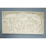 An 18th century Flemish carved ivory plaque (initials OF?) with scenes of hunters and village