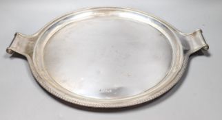 A George V silver circular two handled tray, with engraved border, John Round & Son Ltd,