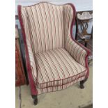 A 19th century Louis XVI style upholstered wing armchair, width 71cm, depth 74cm, height 104cm