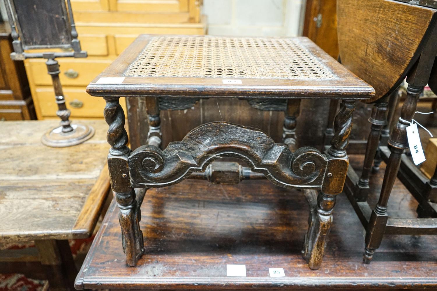 A 17th century style carved oak stool, with caned seat and H stretcher, width 47cm, depth 46cm, - Image 2 of 3