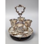 A late Victorian silver egg cruet,, with four cups and four associated spoons, Martin, Hall & Co,