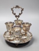 A late Victorian silver egg cruet,, with four cups and four associated spoons, Martin, Hall & Co,