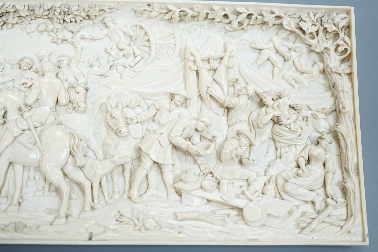 An 18th century Flemish carved ivory plaque (initials OF?) with scenes of hunters and village - Image 3 of 4