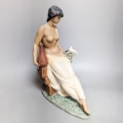 A Lladro stoneware figurine ‘Solitude’, Height 34cm. Width 25cm.