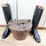 A gents 8 1/2 sized riding boots and a brown leather case for a top hat