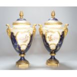 A pair of large Coalport landscape painted vases and covers, c.1900, 30cm