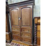 A late Victorian mahogany press cupboard (altered), width 114cm, height 182cm