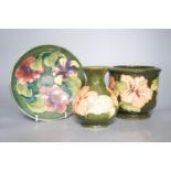 A Moorcroft hibiscus pattern vase, bowl and plant pot 19cm