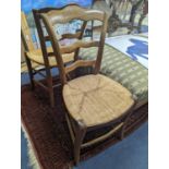 A pair of 19th century French rush seat walnut dining chairs