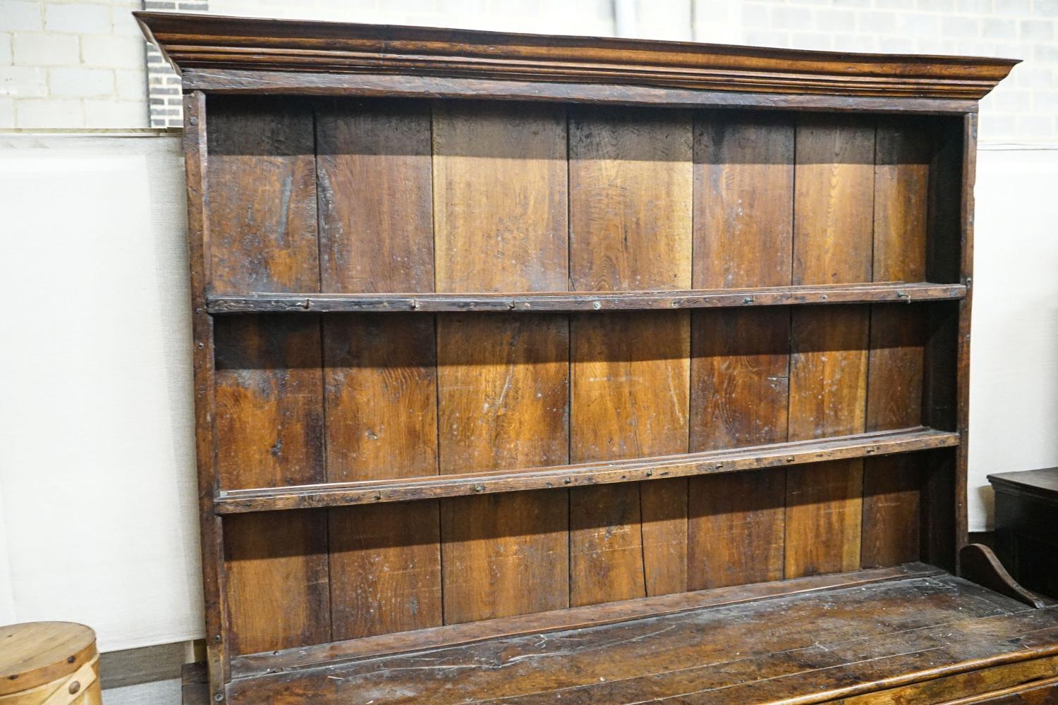 A George III oak dresser, with two shelf rack and three long drawers, on chamfered legs, width - Image 2 of 3