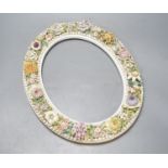 A 19th century English porcelain floral encrusted oval frame 32cm