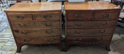 A pair of reproduction George III style bow fronted mahogany bedside chests, width 66cm, depth 39cm,