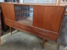 A mid century Danish teak sideboard, length 184cm, depth 44cm, height 115cm