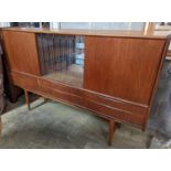 A mid century Danish teak sideboard, length 184cm, depth 44cm, height 115cm