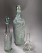 A collection of antique glass bottles and jars