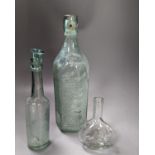 A collection of antique glass bottles and jars