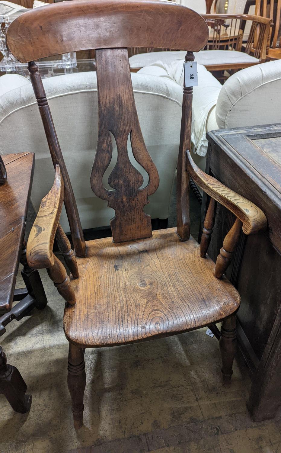 A Victorian elm and beech Windsor armchair with pierced splat stamped J D 33, width 56cm, depth