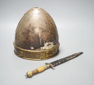A Middle-Eastern silvered metal and brass helmet and a dagger in sheath
