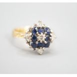 A 1960's 18ct gold, sapphire and diamond cluster ring, size Q, gross weight 5.8 grams.