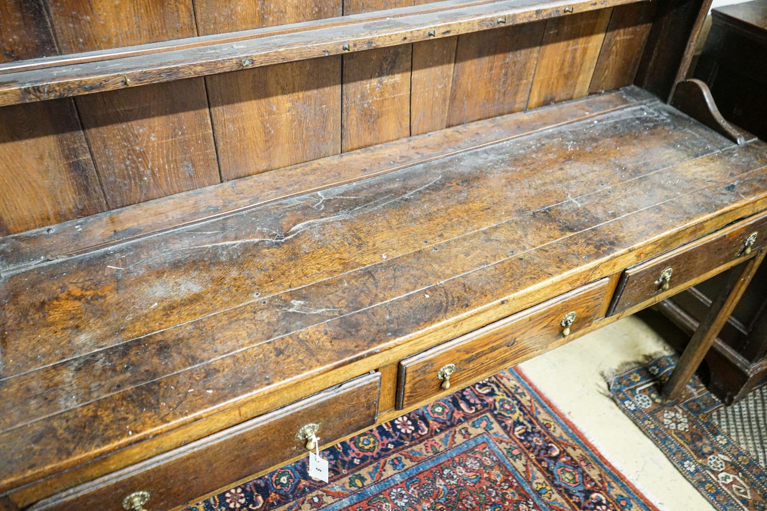 A George III oak dresser, with two shelf rack and three long drawers, on chamfered legs, width - Image 3 of 3