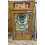 An Extrawin coin operated games machine, 87cms high.