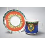 A set of eight Versace 'Le Roi Soleil' pattern cups and saucers