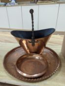 A copper coal scuttle and an Arts and Crafts hammered copper bowl and a similar tray