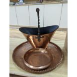 A copper coal scuttle and an Arts and Crafts hammered copper bowl and a similar tray