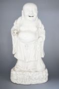 A Chinese blanc-de-chine figure of Budai, 19cm