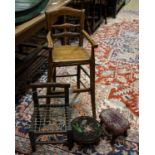 An early 19th century primitive mahogany child's chair, with strung seat, height 29cm, a beech