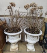 A pair of Victorian style white painted cast metal campana garden urns, height 62cm