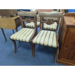 A set of six Regency mahogany dining chairs on sabre legs