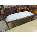 An Edwardian inlaid mahogany slat back settee, length 164cm, depth 47cm, height 74cm