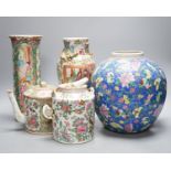 Two Chinese famille rose vases, two Chinese famille rose teapots and a blue ground enamelled jar
