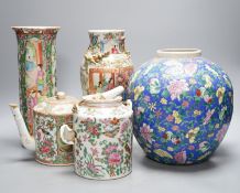 Two Chinese famille rose vases, two Chinese famille rose teapots and a blue ground enamelled jar