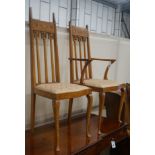 A pair of Art Nouveau inlaid mahogany chairs, one with arms