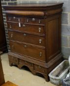 An 18th century oak chest on stand, width 104cm, depth 56cm, height 133cm