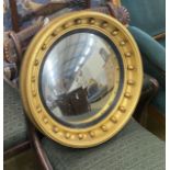 A Regency style circular gilt framed convex wall mirror, diameter 41cm