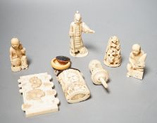 Three Japanese Ivory figures of men, a similar bezique marker, a Japanese staghorn single section