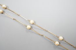 A yellow metal and cultured pearl set necklet, 70cm, gross weight 11.5 grams.