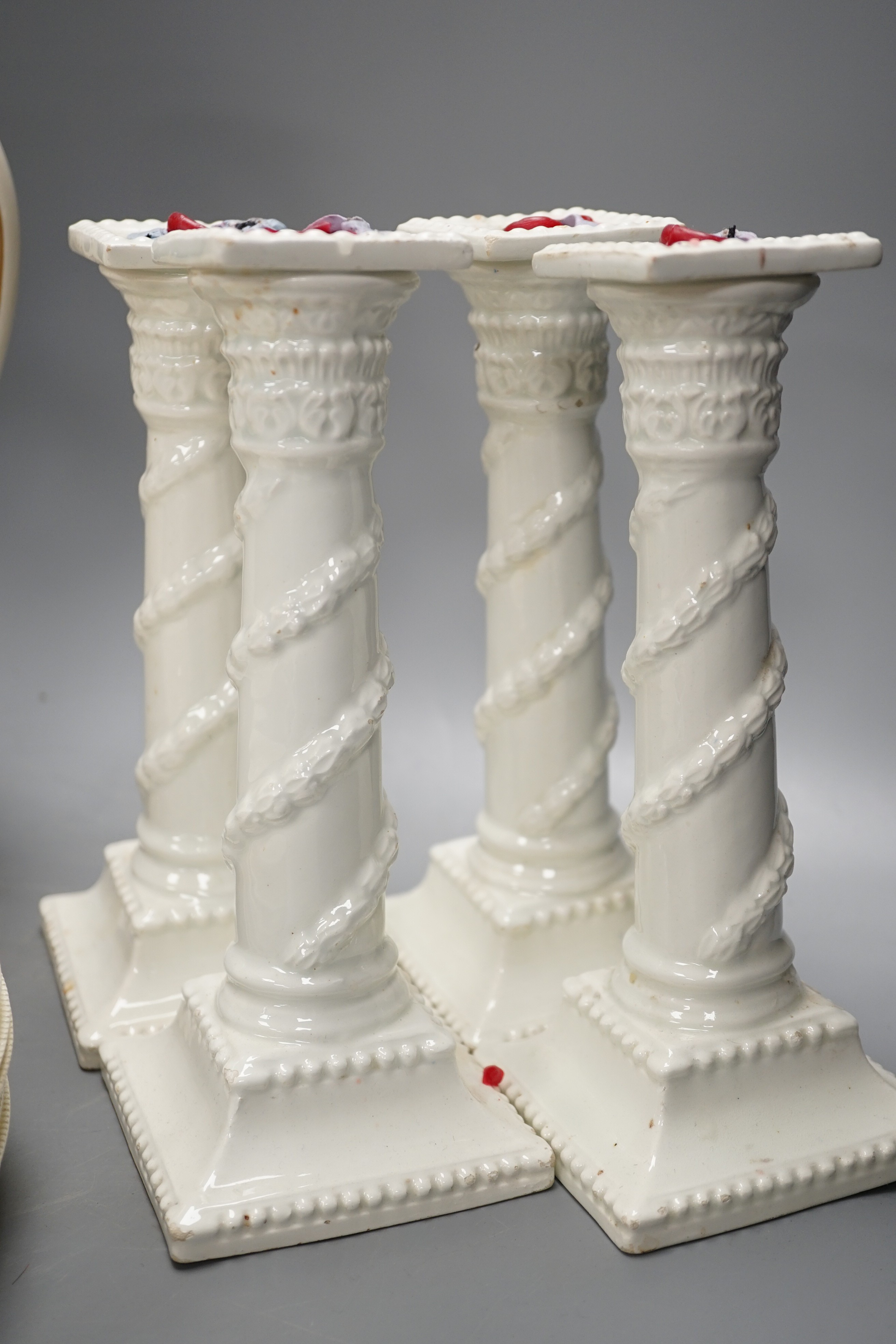 A set of seven early 19th century creamware plates, four later creamware candlesticks and an ivory - Image 6 of 7