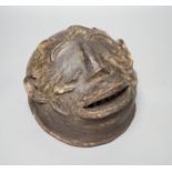 A terracotta Makonde helmet mask (Tanzanian) 21cm diameter