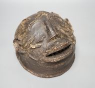 A terracotta Makonde helmet mask (Tanzanian) 21cm diameter