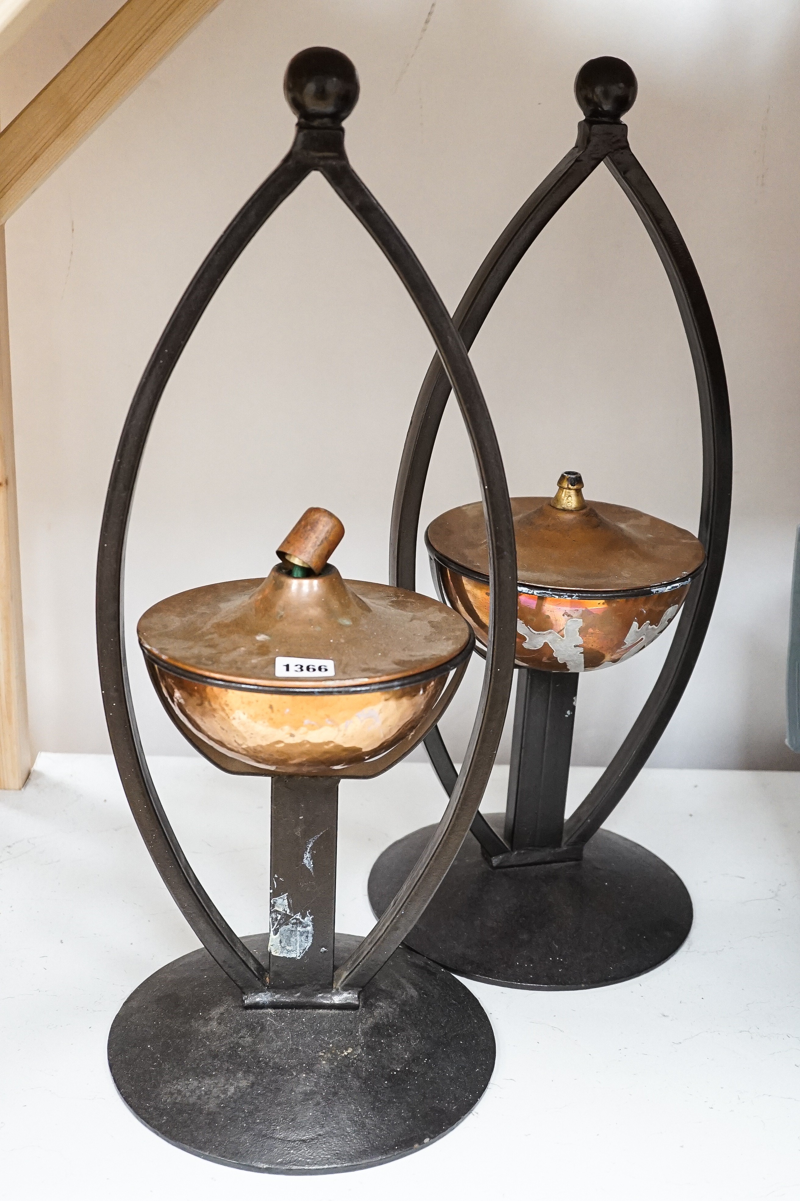 A pair of decorative copper lamps in arched mounts, 61 cms high. - Image 2 of 4