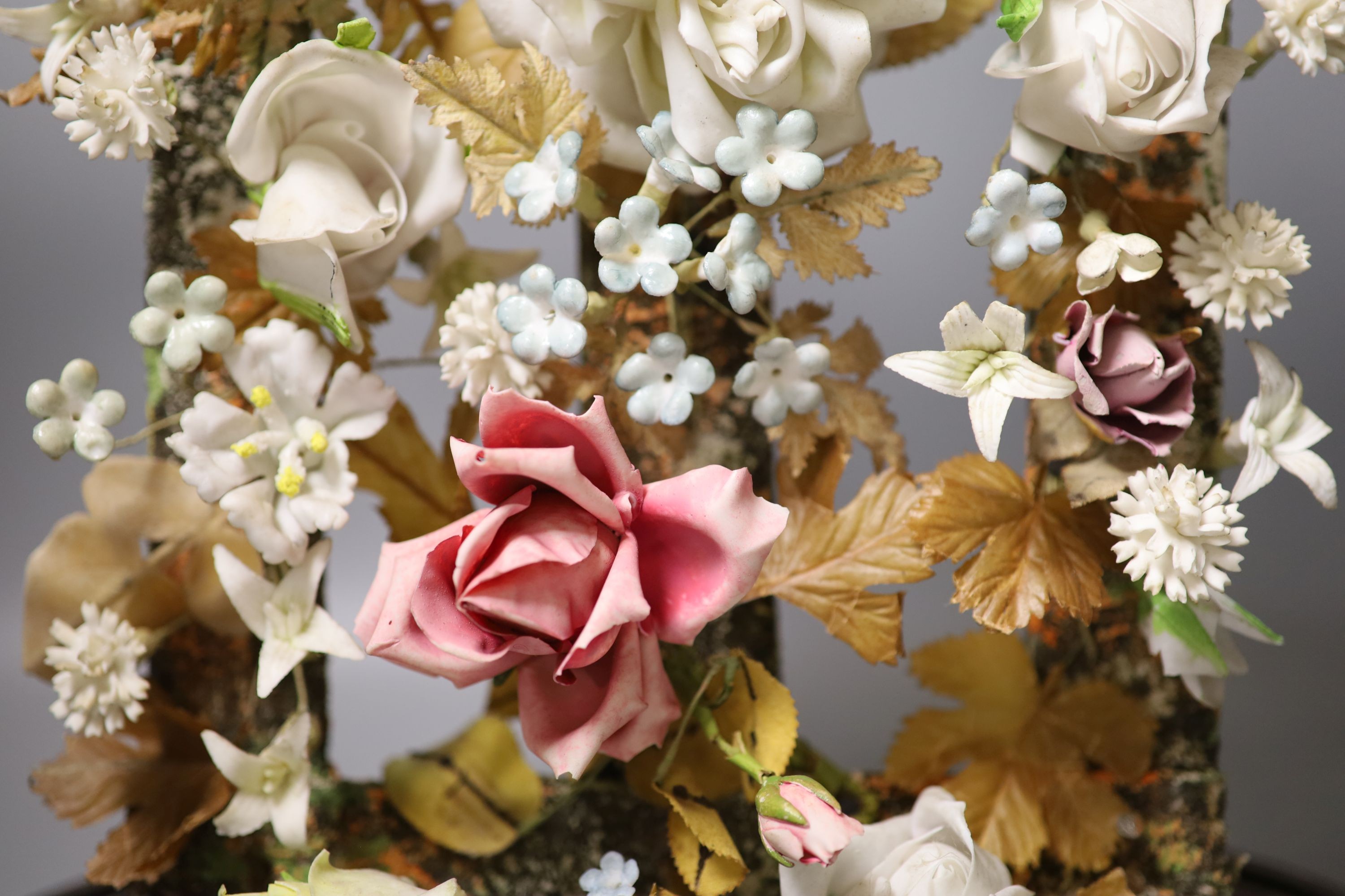 A late 19th century model of porcelain flowers under a glass dome 52cm total height - Image 5 of 5