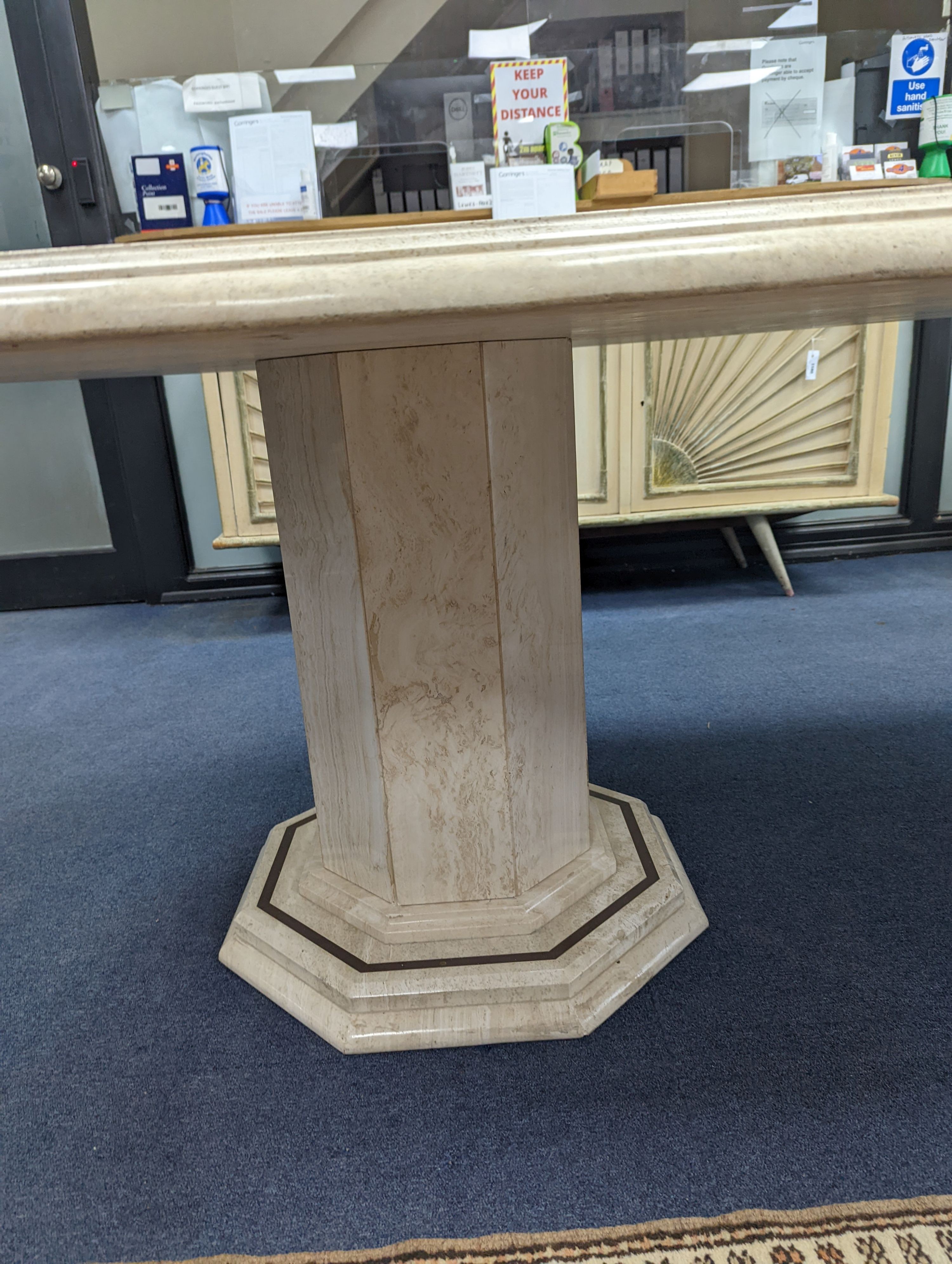 A Travertine marble dining table of elongated ocgtagonal form on twin octagonal column supports, - Image 6 of 7