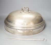 A silver plated cloche / meat cover and a plated meat skewer