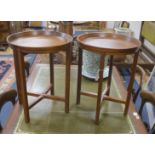 A pair of circular mahogany folding tray top occasional tables, diameter 46cm, height 60cm