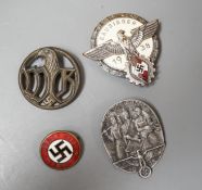 A WW2 German Hitler Youth Gausieger badge, a Wehrmachtgefolge badge for civilian workers, a Tag