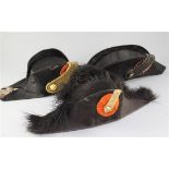 Three 19th century officer's bicorn hats,one by J.P. Hol of Braeda,